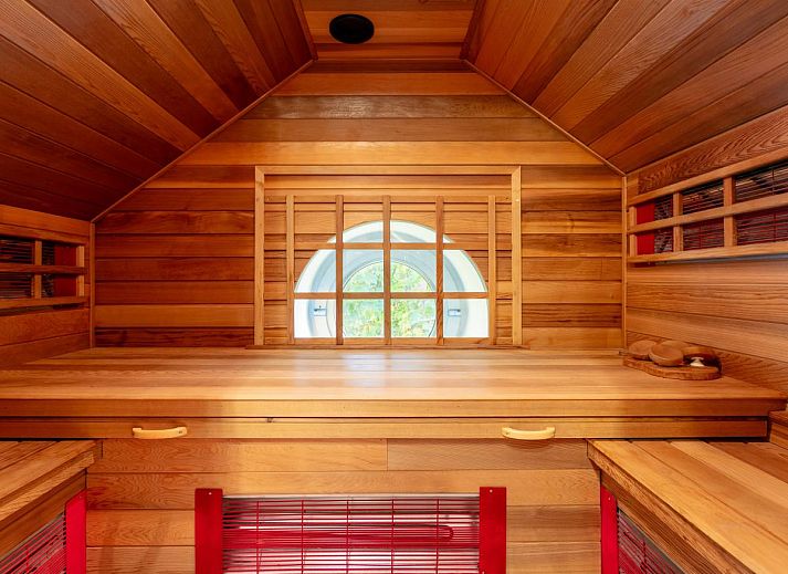 Cozy living room with wood stove in Au Ballon, vacation home in Manhay, Ardennes, Belgium.