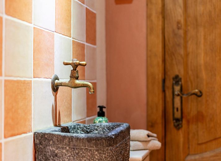 Cozy living room with wood stove in Au Ballon, vacation home in Manhay, Ardennes, Belgium.