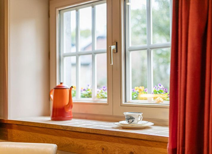 Cozy living room with wood stove in Au Ballon, vacation home in Manhay, Ardennes, Belgium.