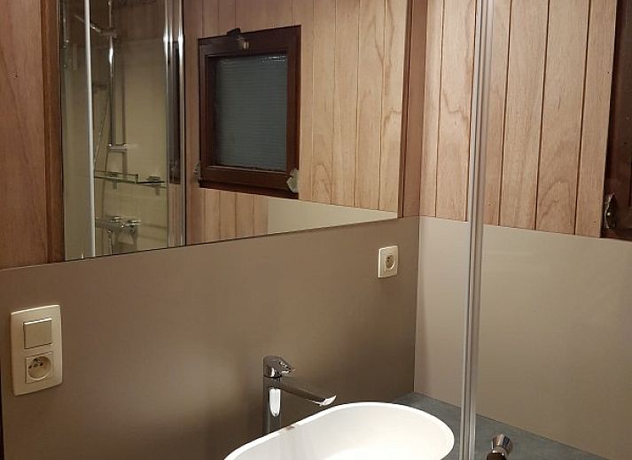 Wooden veranda of chalet Da Vinci, La Roche-en-Ardenne, with seating in the Ardennes, Belgium.