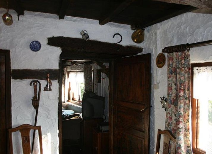 Charming Cottage in Buisson, vacation home in Ardennes, Luxembourg, Belgium with rustic stone facade and colorful flowers.
