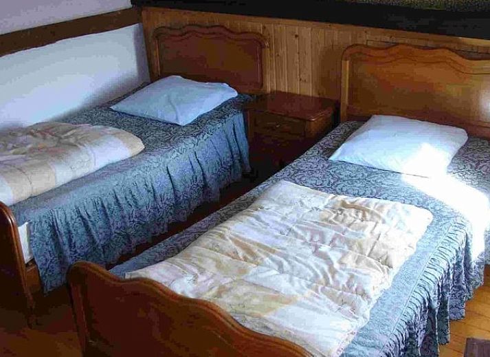 Charming Cottage in Buisson, vacation home in Ardennes, Luxembourg, Belgium with rustic stone facade and colorful flowers.