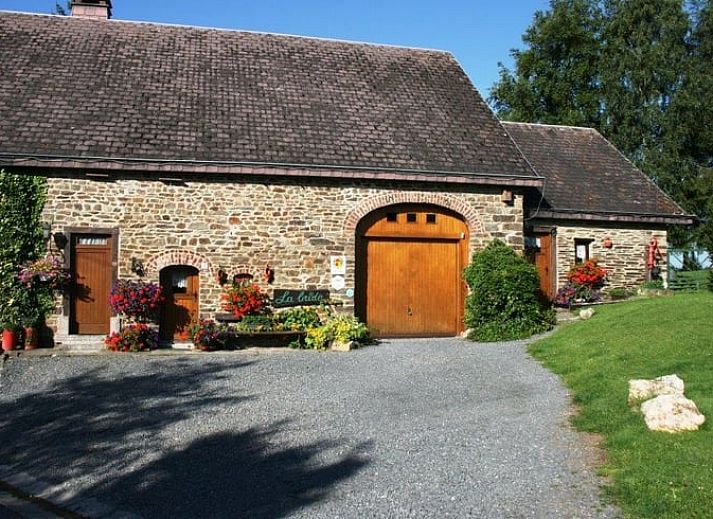 Cozy interior of Cottage in Buisson, vacation home in the Ardennes, Belgium, with rustic wooden details and rural charm.