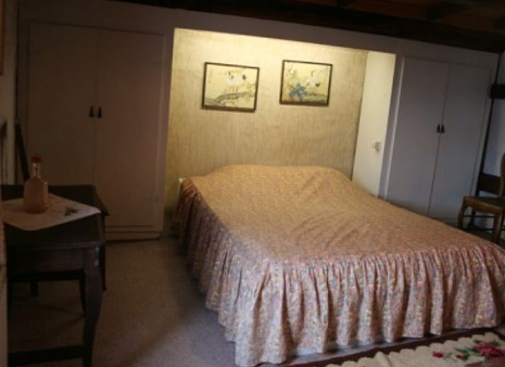 Cozy interior of Cottage in Buisson, vacation home in the Ardennes, Belgium, with rustic wooden details and rural charm.