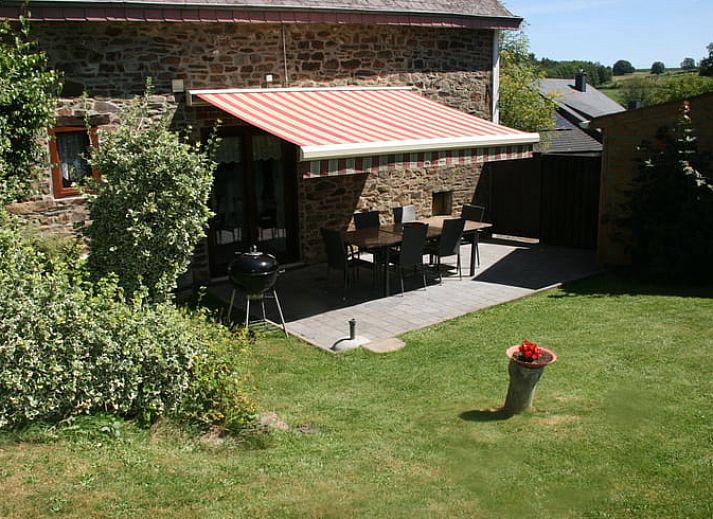 Authentic kitchen shelf in Cottage in Buisson, cottage in the Ardennes, Belgium, with rustic plates and mugs for a cozy atmosphere.