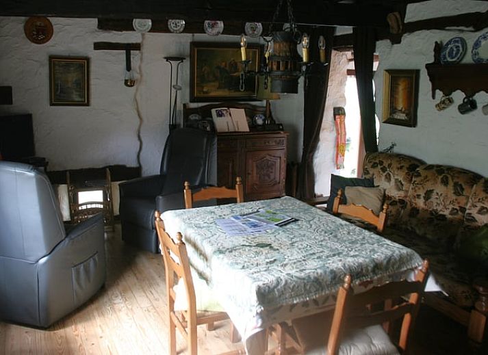 Authentic kitchen shelf in Cottage in Buisson, cottage in the Ardennes, Belgium, with rustic plates and mugs for a cozy atmosphere.