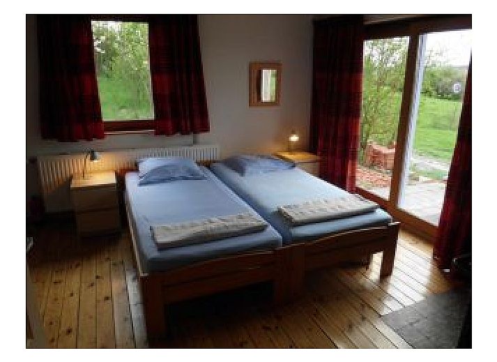 Gezellige woonkamer in La Terra vakantiehuis, Durbuy, met comfortabele banken.