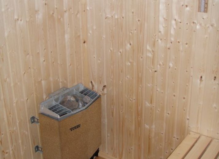 Chalet du bois in Biron, Ardennes with an inviting terrace surrounded by green nature.