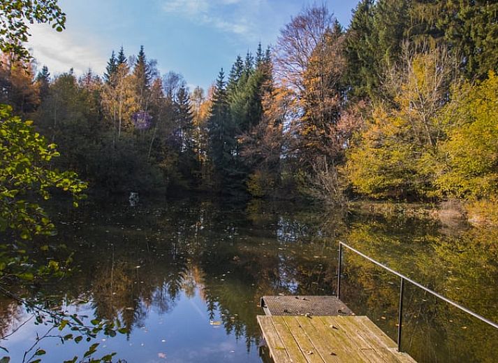 Veranda of cottage in Our, Ardennes, Belgium with spacious seating area.