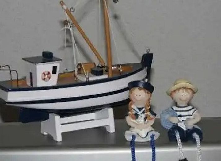 Geniet van de zonnige tuin en het terras bij Seaside Village, huisje 77, een charmant vakantiehuis in Vosseslag, De Haan, Belgische kust.