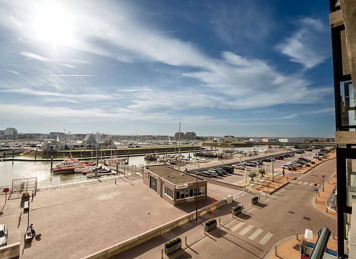 Bright living room in Apartment Bella II overlooking the harbor in Blankenberge, Belgian coast. Comfortable accommodation with modern furnishings.