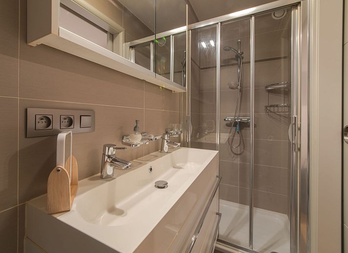 Stylish living room in Apartment Sea Breeze, Bredene on the Belgian coast, with modern furnishings and comfortable seating area.