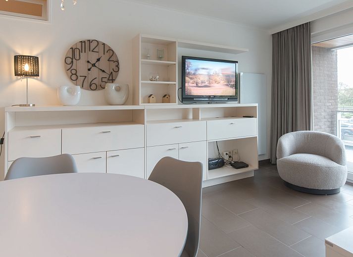 Stylish living room in Apartment Sea Breeze, Bredene on the Belgian coast, with modern furnishings and comfortable seating area.