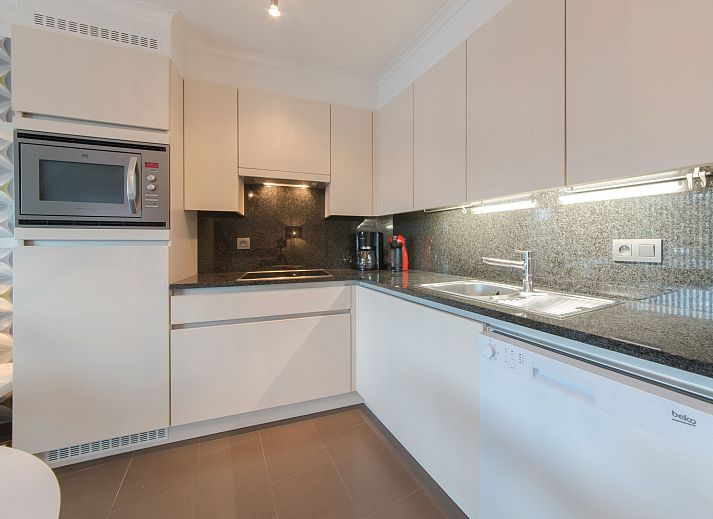 Stylish living room in Apartment Sea Breeze, Bredene on the Belgian coast, with modern furnishings and comfortable seating area.