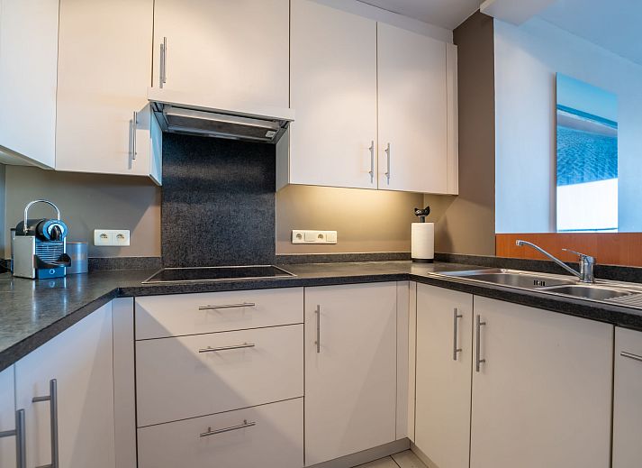 Cozy living room in Apartment Marebelle, Bredene, Belgian coast, with modern decor and open kitchen for a relaxing stay.