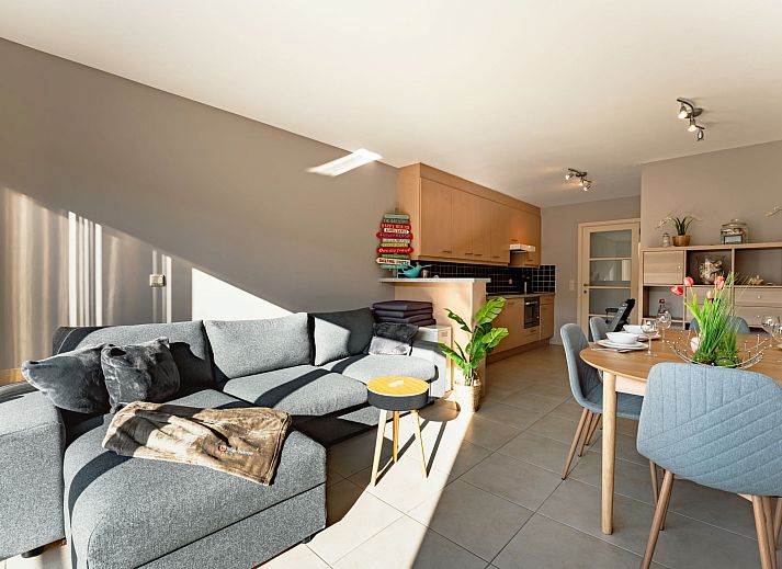 Cozy interior of the Zandloper Apartment with a balcony in Bredene, on the Belgian coast-an ideal vacation rental with a modern kitchen and sitting area.