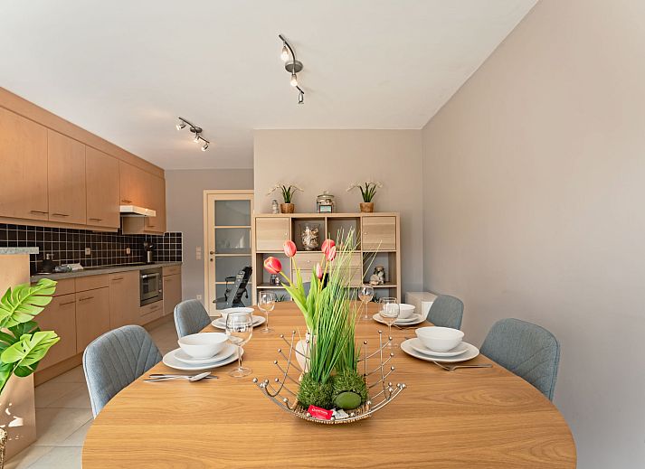 Cozy interior of the Zandloper Apartment with a balcony in Bredene, on the Belgian coast-an ideal vacation rental with a modern kitchen and sitting area.