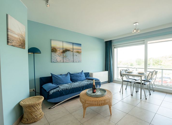 Bright living room of Apartment Lautrec in Bredene, Belgian coast, with a view of nature and a cozy sitting area.