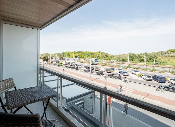 Bright living room of Apartment Lautrec in Bredene, Belgian coast, with a view of nature and a cozy sitting area.