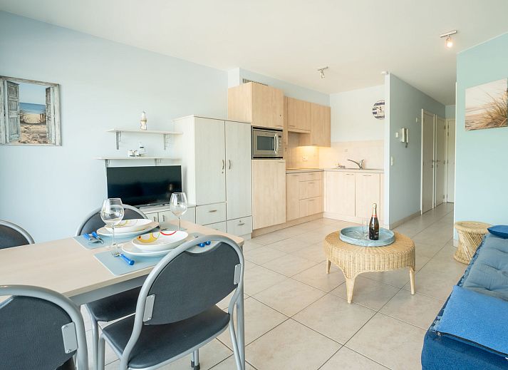 Cozy living room in Apartment Lautrec, Bredene, Belgian coast. Comfortable indoor space with a view of the green surroundings.