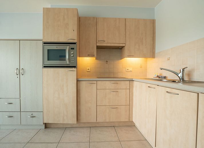 Cozy indoor space of Apartment Lautrec in Bredene on the Belgian coast, with modern kitchen and comfortable seating area.