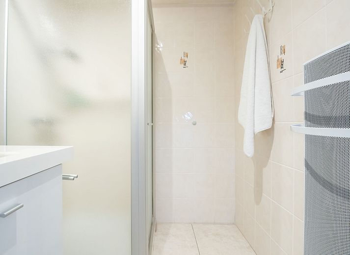 Stylish living room of Apartment Lautrec in Bredene, Belgian coast, with comfortable seating area and modern furnishings.