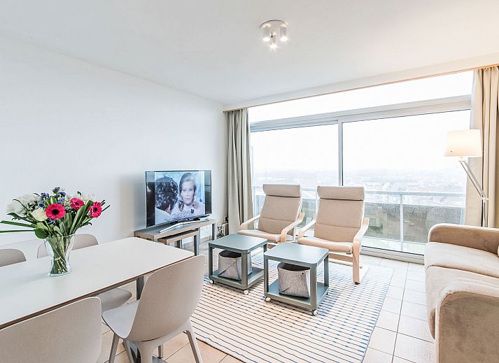Cozy living room of Apartment Seaview 2 in Bredene, Belgian coast, with modern furnishings and comfortable seating area.