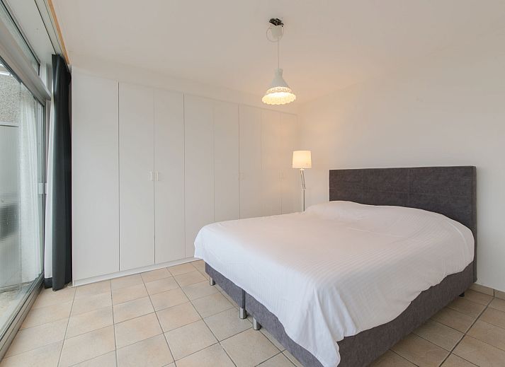 Cozy living room of Apartment Seaview 2 in Bredene, Belgian coast, with modern furnishings and comfortable seating area.