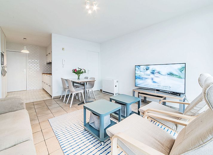 Cozy living room of Apartment Seaview 2 in Bredene, Belgian coast, with modern furnishings and comfortable seating area.