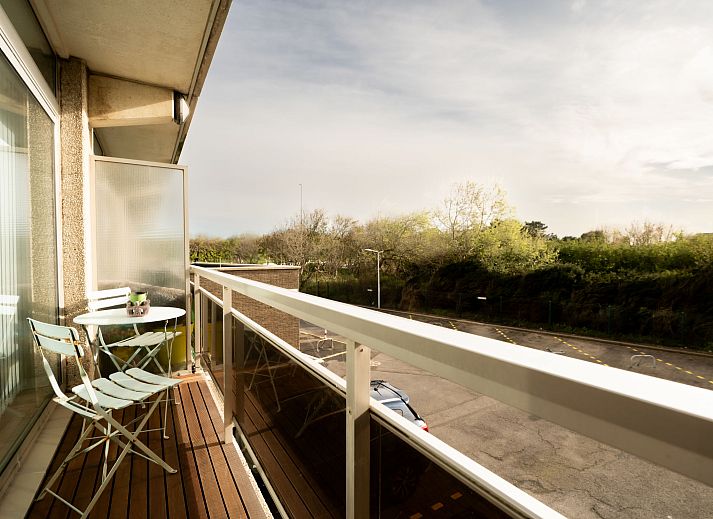 Cozy living room of Apartment Astrid 62/101 in Bredene, Belgian coast, with comfortable sitting area and dining area for a relaxing stay.