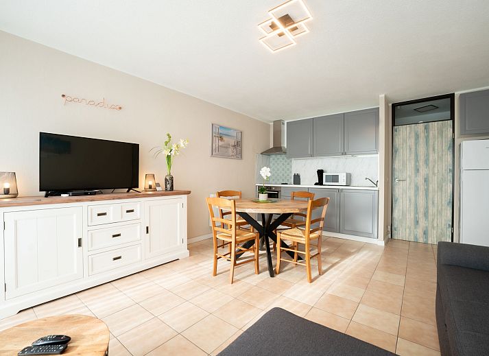 Cozy interior space of Apartment Astrid 62/ 101 in Bredene, Belgian coast, with modern kitchen and sunny dining area.