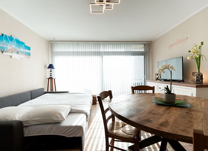 Cozy interior space of Apartment Astrid 62/ 101 in Bredene, Belgian coast, with modern kitchen and sunny dining area.