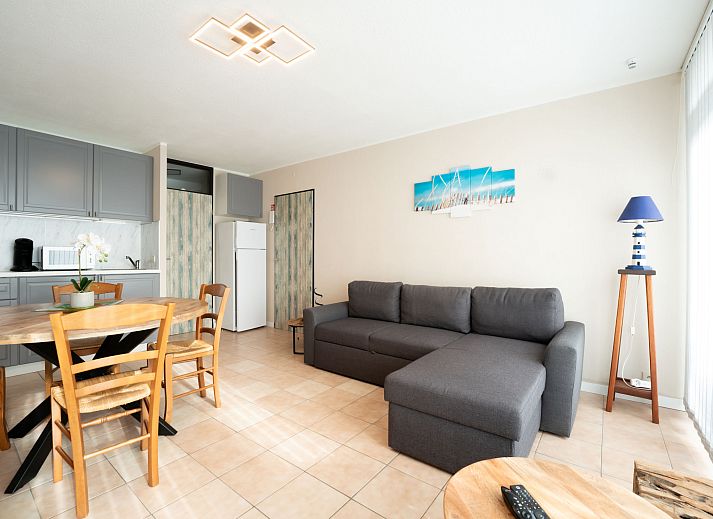 Cozy interior space of Apartment Astrid 62/ 101 in Bredene, Belgian coast, with modern kitchen and sunny dining area.