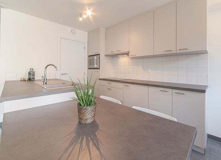 Stylish living room and kitchen of Apartment Medano in Bredene, Belgian coast, ideal vacation home with modern decor.