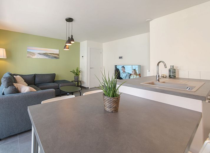 Stylish living room and kitchen of Apartment Medano in Bredene, Belgian coast, ideal vacation home with modern decor.