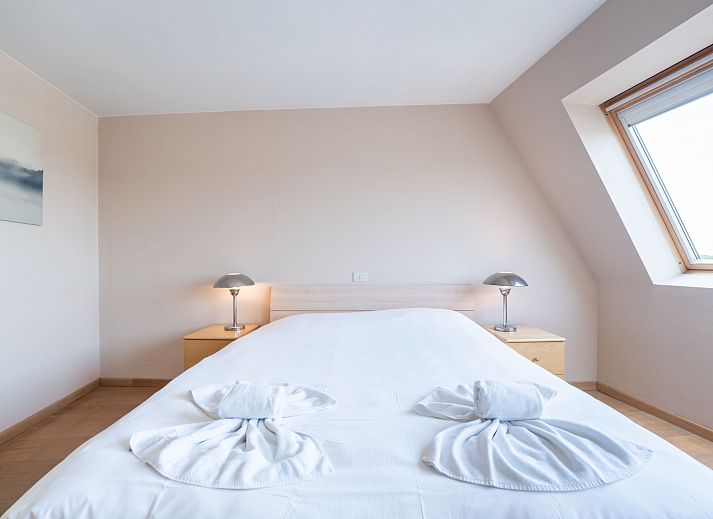 Cozy living room of Apartment Queen Mary in Bredene on the Belgian coast, with comfortable interior and views of the natural surroundings.