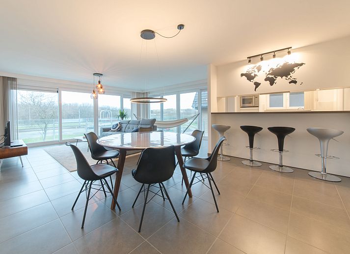 Stylish living room of Apartment Ocean in Bredene, Belgian coast, with modern decor and lots of natural light.