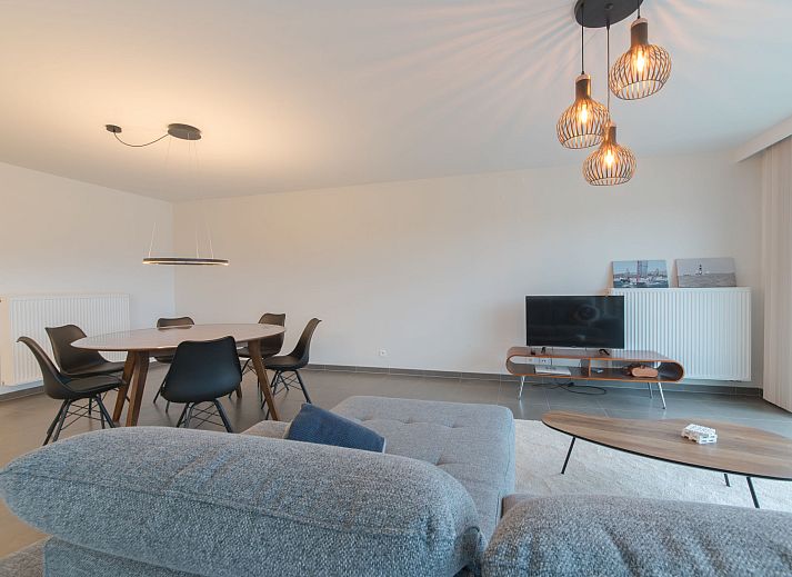 Stylish interior space of Apartment Ocean in Bredene, Belgian coast, with modern dining room and views of the surroundings.