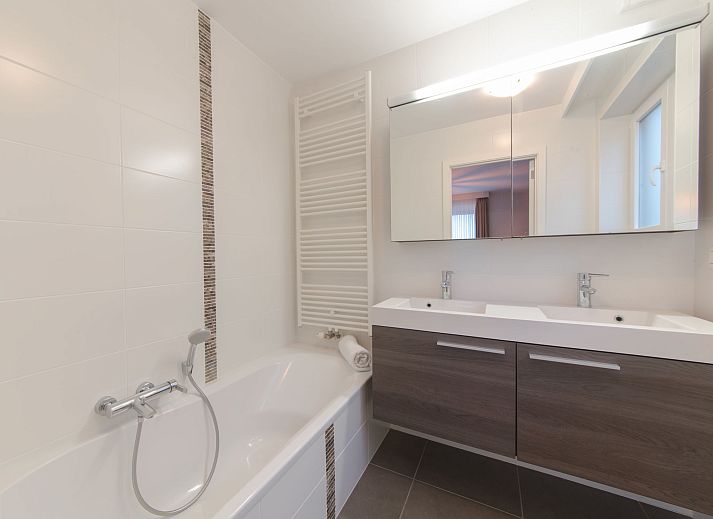 Stylish interior space of Apartment Ocean in Bredene, Belgian coast, with modern dining room and views of the surroundings.