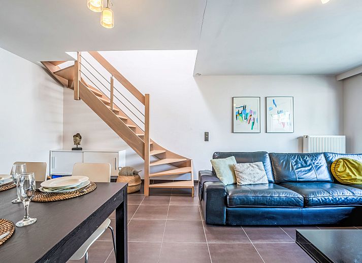 Stylish living room of Apartment Ter Duyne in Bredene, Belgian coast, with modern furnishings and comfortable seating area.