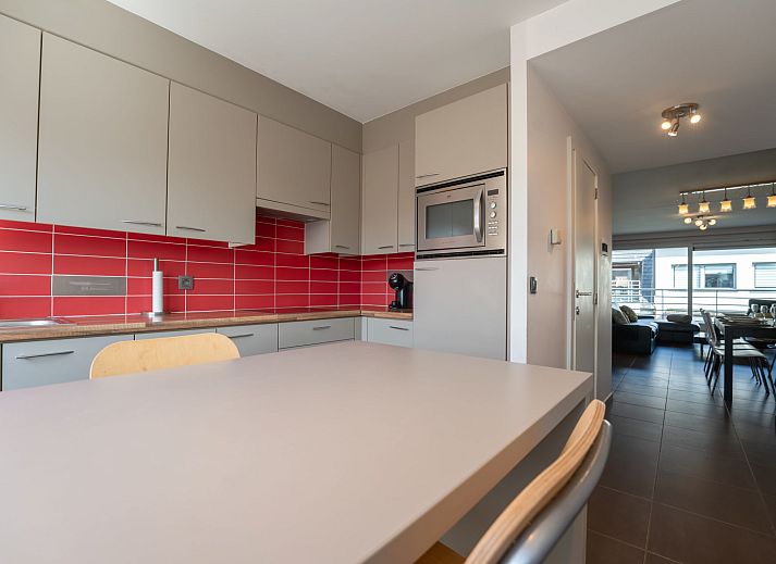 Stylish living room of Apartment Ter Duyne in Bredene, Belgian coast, with modern furnishings and comfortable seating area.