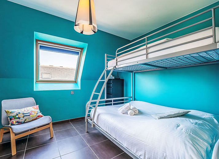 Modern kitchen in Apartment Ter Duyne, Bredene on the Belgian coast, with red tiles and sleek decor for a comfortable stay.