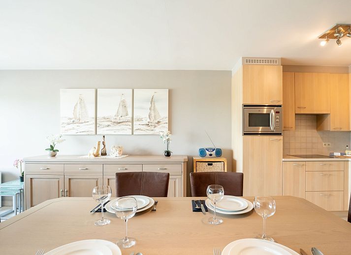 Cozy living room of Apartment Lautrec 304 in Bredene, Belgian coast, with comfortable sitting area and dining area.