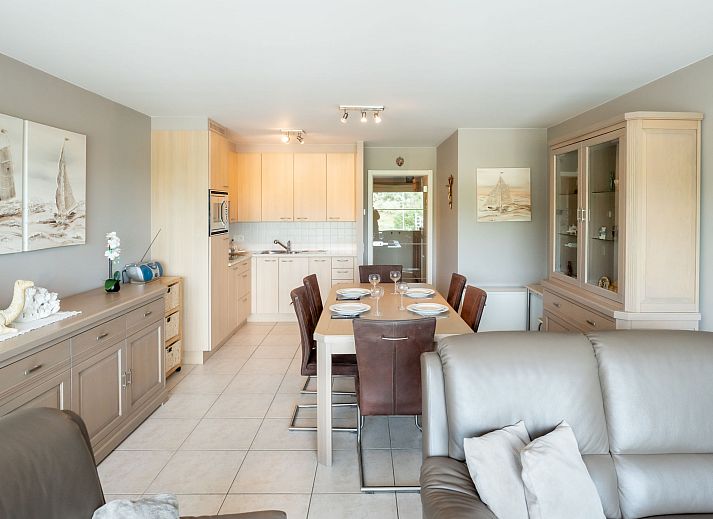 Cozy living room of Apartment Lautrec 304 in Bredene, Belgian coast, with comfortable sitting area and dining area.