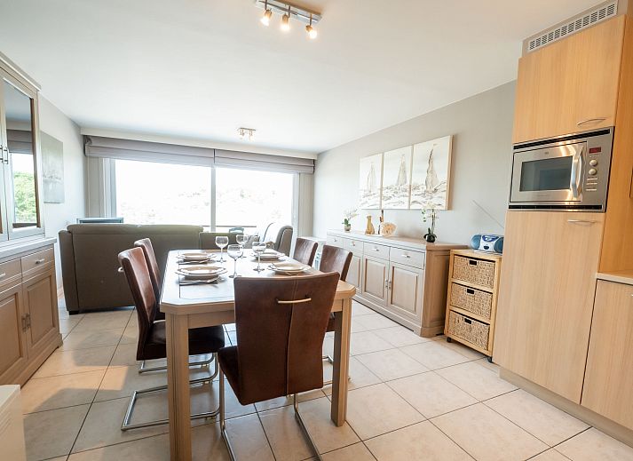 Cozy dining area in Apartment Lautrec 304 in Bredene, Belgian coast, with modern kitchen and stylish decor.