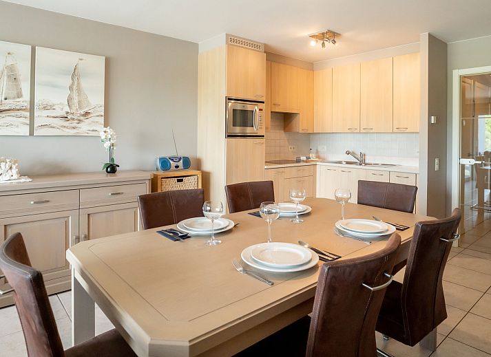 Cozy dining area in Apartment Lautrec 304 in Bredene, Belgian coast, with modern kitchen and stylish decor.