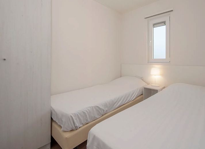 Cozy living room of Chalet in Bredene on the Belgian coast with modern decor and lots of natural light.