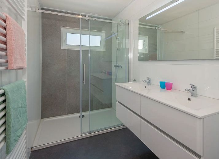 Cozy living room of Chalet in Bredene on the Belgian coast with modern decor and lots of natural light.
