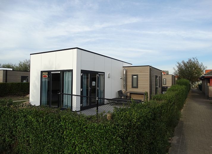 Cozy living room of Chalet in Bredene on the Belgian coast with modern decor and lots of natural light.