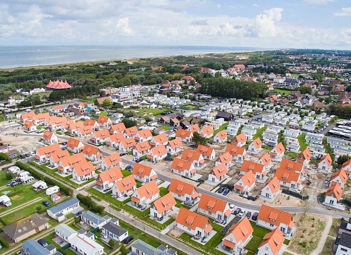 Cozy living room in Chalet in Bredene, Belgian coast, with modern decor and bright dining area for a relaxing vacation stay.